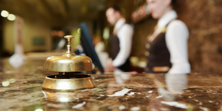 Front desk with a bell in foreground